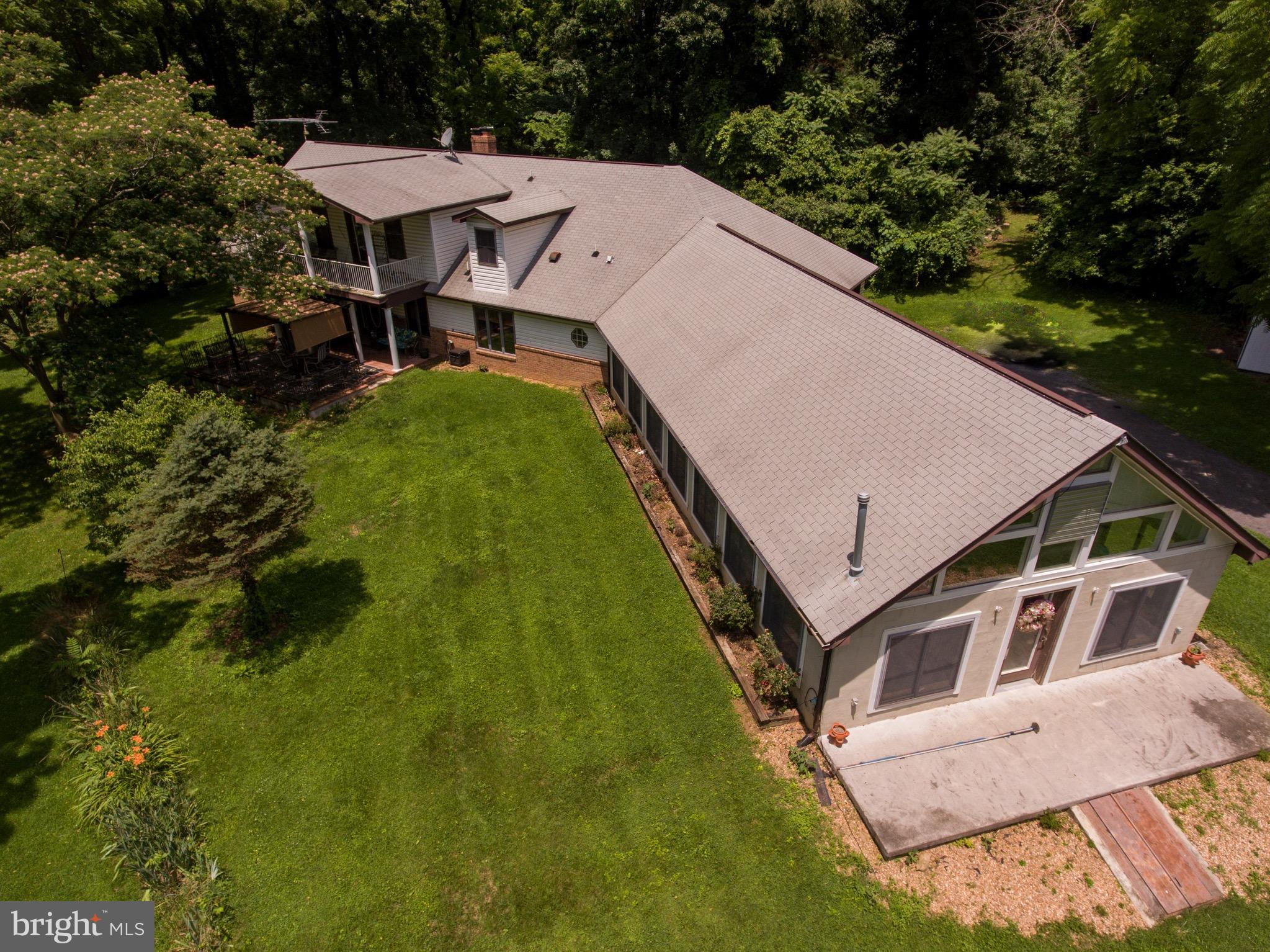 2619 Apple Pie Ridge Road Winchester, VA 22603 - Photo 3 of 29 a aerial view of a house with swimming pool and sitting area