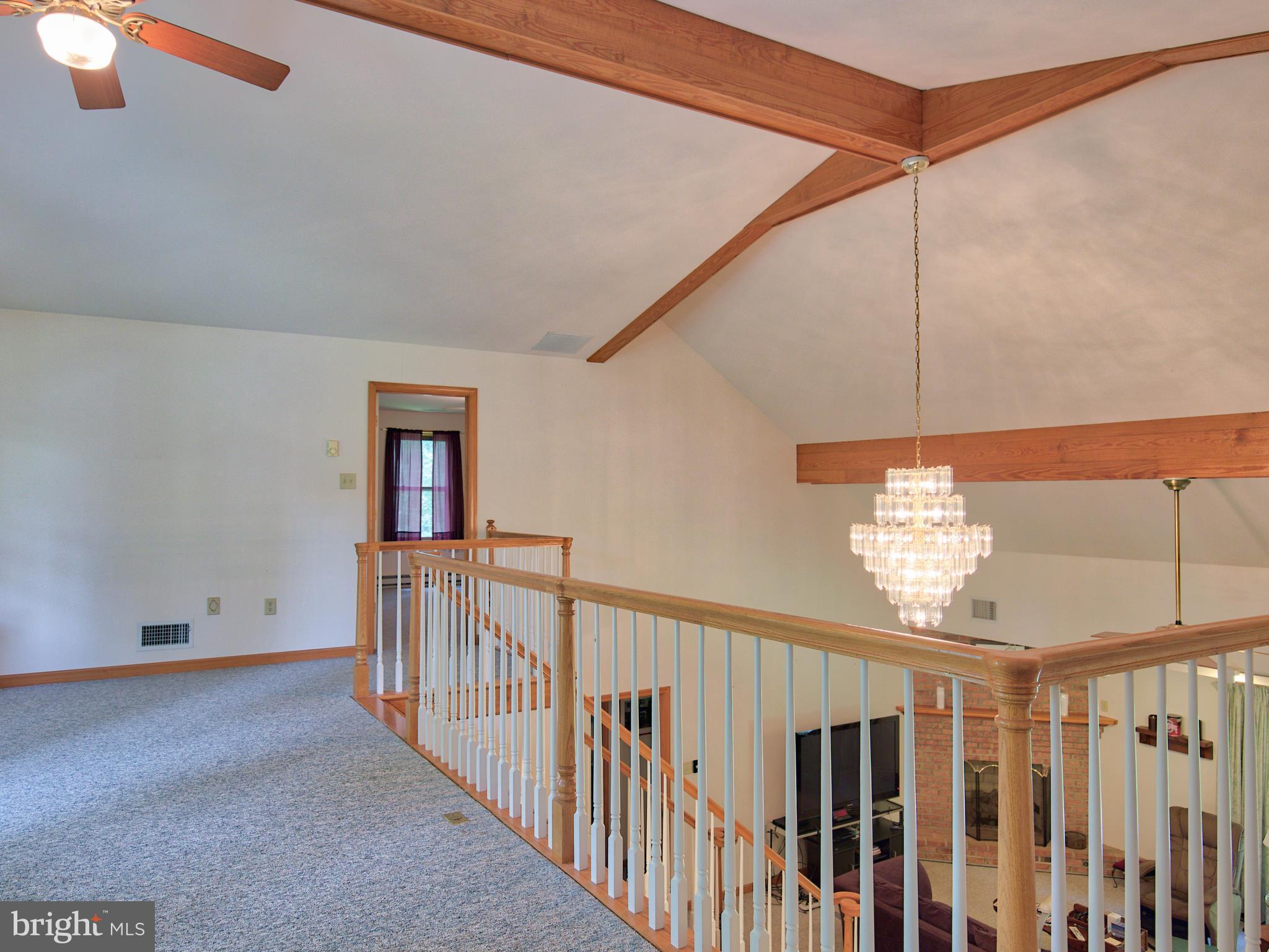 2619 Apple Pie Ridge Road Winchester, VA 22603 - Photo 22 of 29 a view of a hallway with chandelier