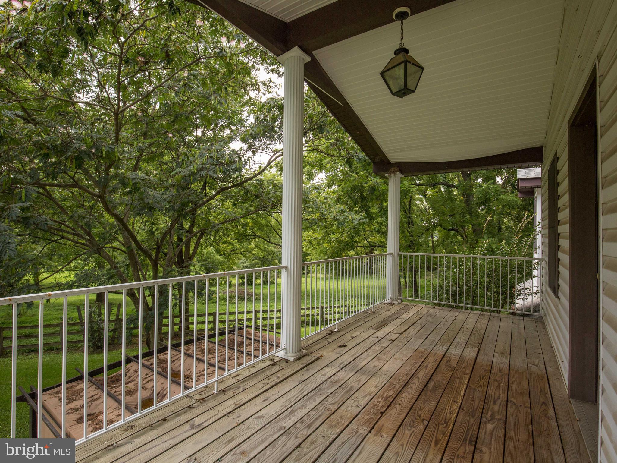 2619 Apple Pie Ridge Road Winchester, VA 22603 - Photo 27 of 29 a view of a deck with wooden floor and fence