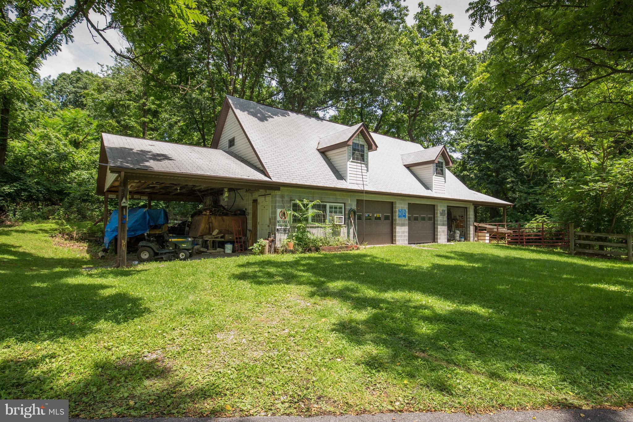 2619 Apple Pie Ridge Road Winchester, VA 22603 - Photo 5 of 29 a front view of a house with a garden