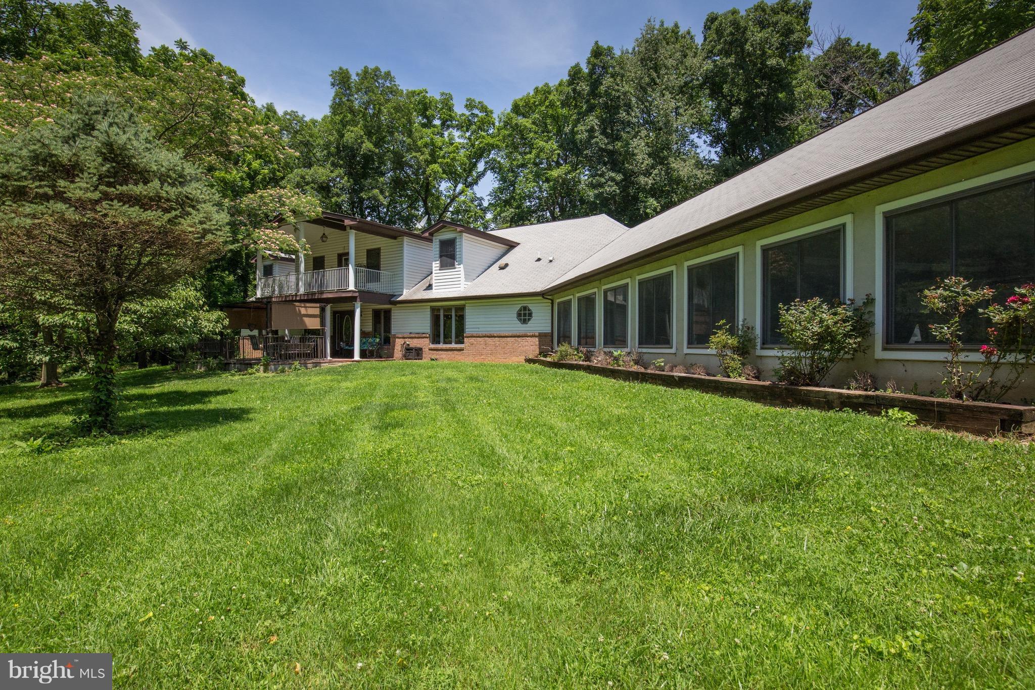 2619 Apple Pie Ridge Road Winchester, VA 22603 - Photo 8 of 29 a front view of a house with garden