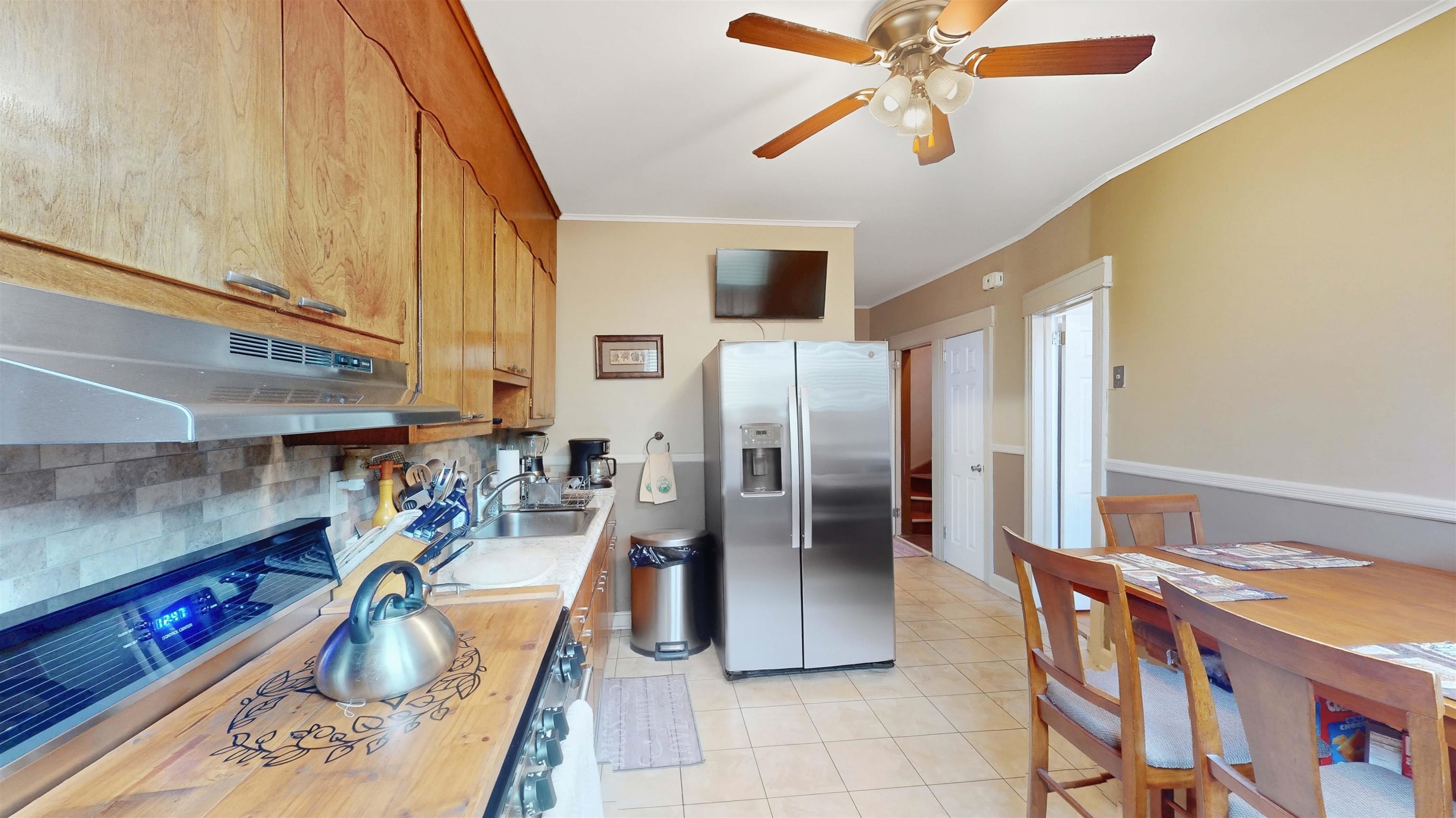 159 West 32nd Street Bayonne, NJ 07002 - Photo 11 of 47 a kitchen with stainless steel appliances granite countertop a refrigerator and a sink