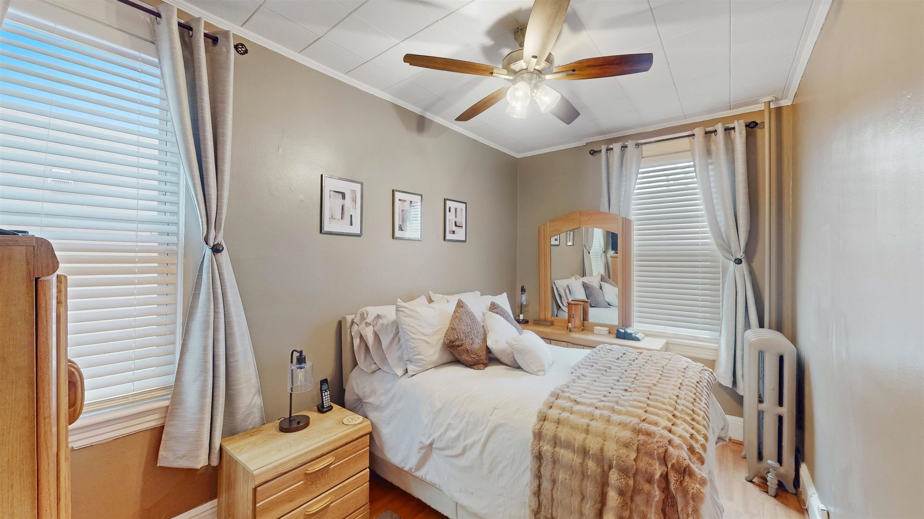 159 West 32nd Street Bayonne, NJ 07002 - Photo 13 of 47 a bedroom with a bed and a chandelier