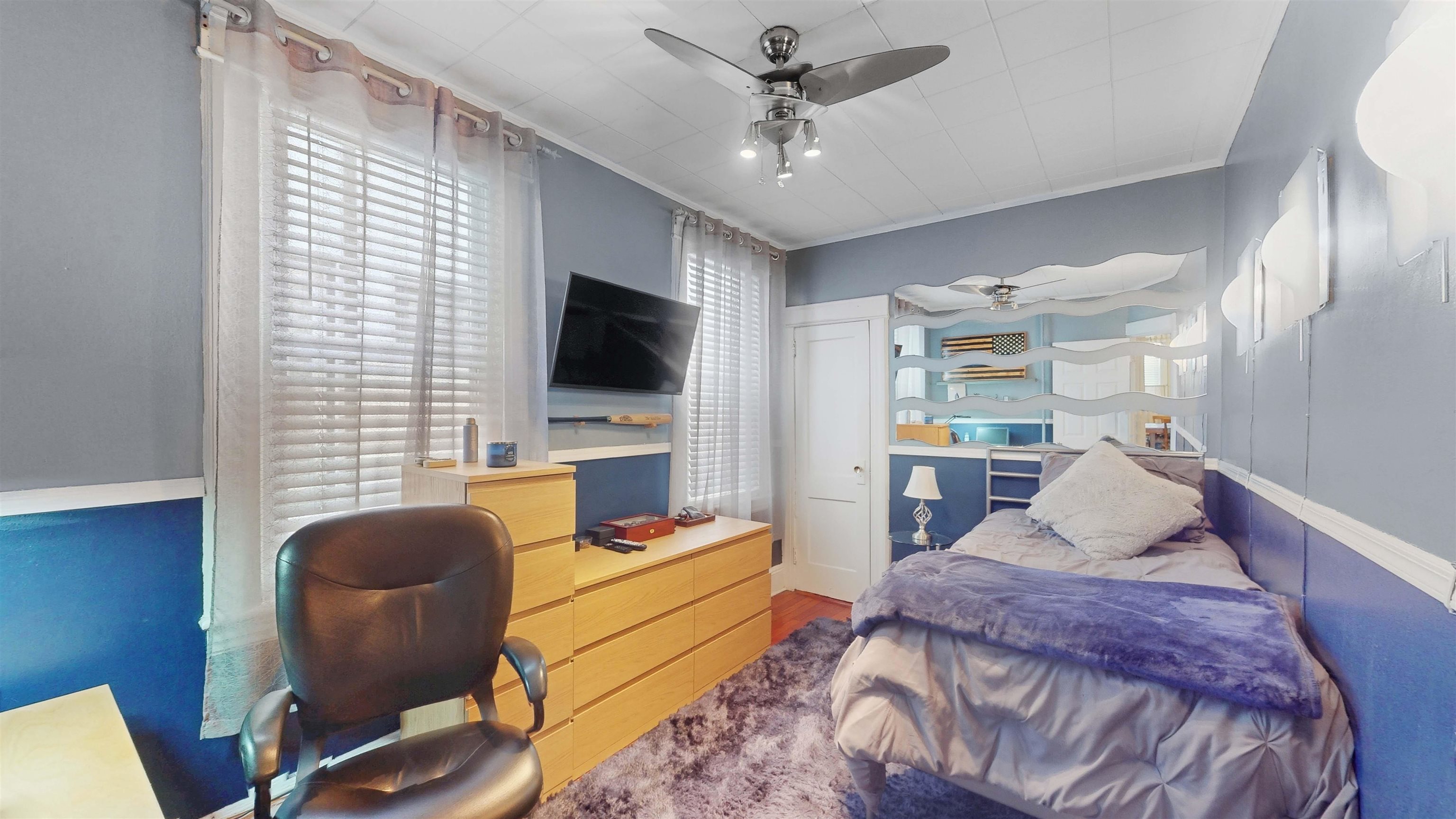 159 West 32nd Street Bayonne, NJ 07002 - Photo 14 of 47 a living room with furniture and a flat screen tv