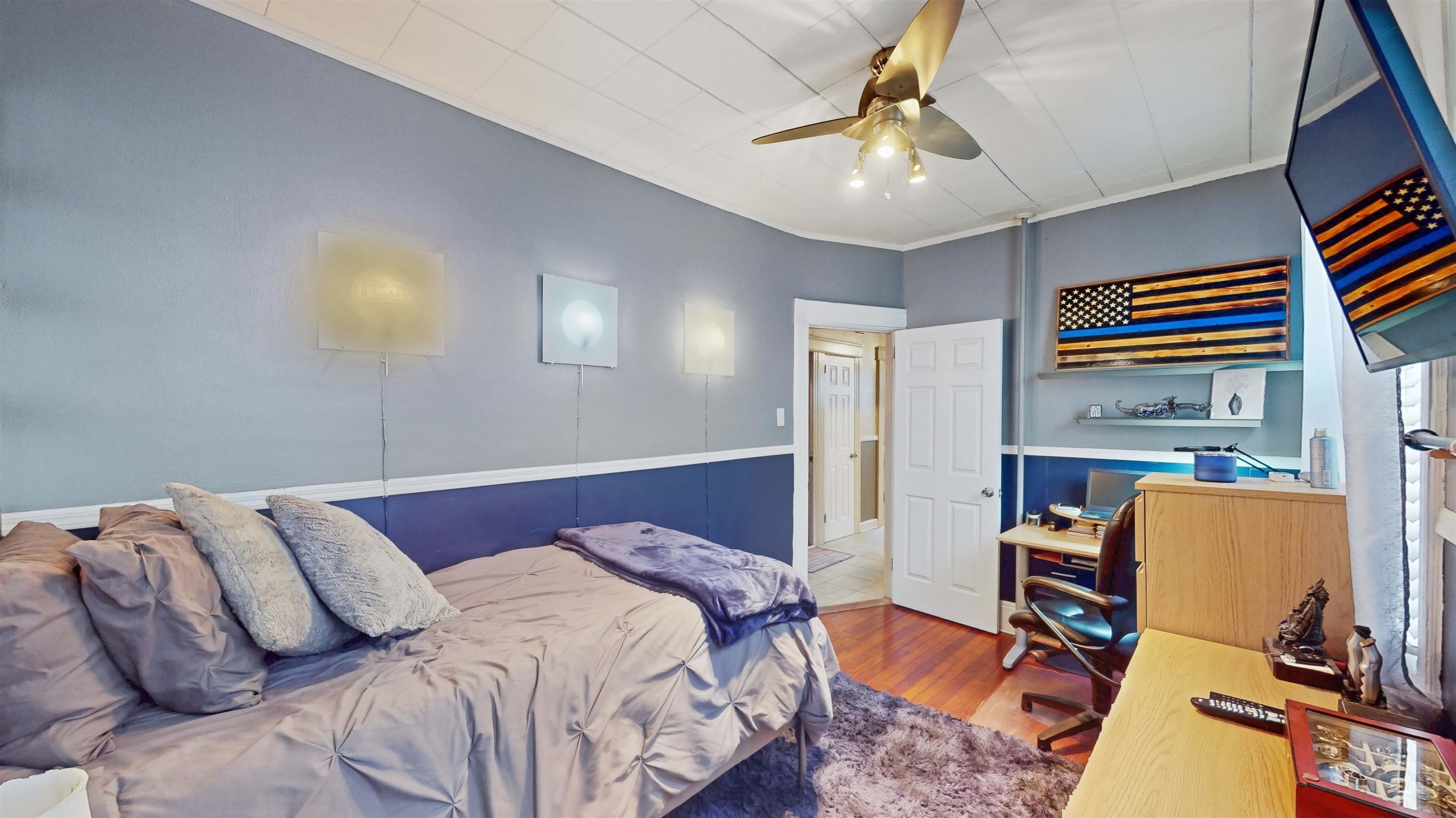 159 West 32nd Street Bayonne, NJ 07002 - Photo 15 of 47 a bedroom with bed and a chandelier