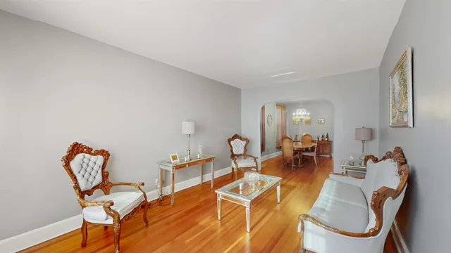 a living room with furniture a dining table and chairs
