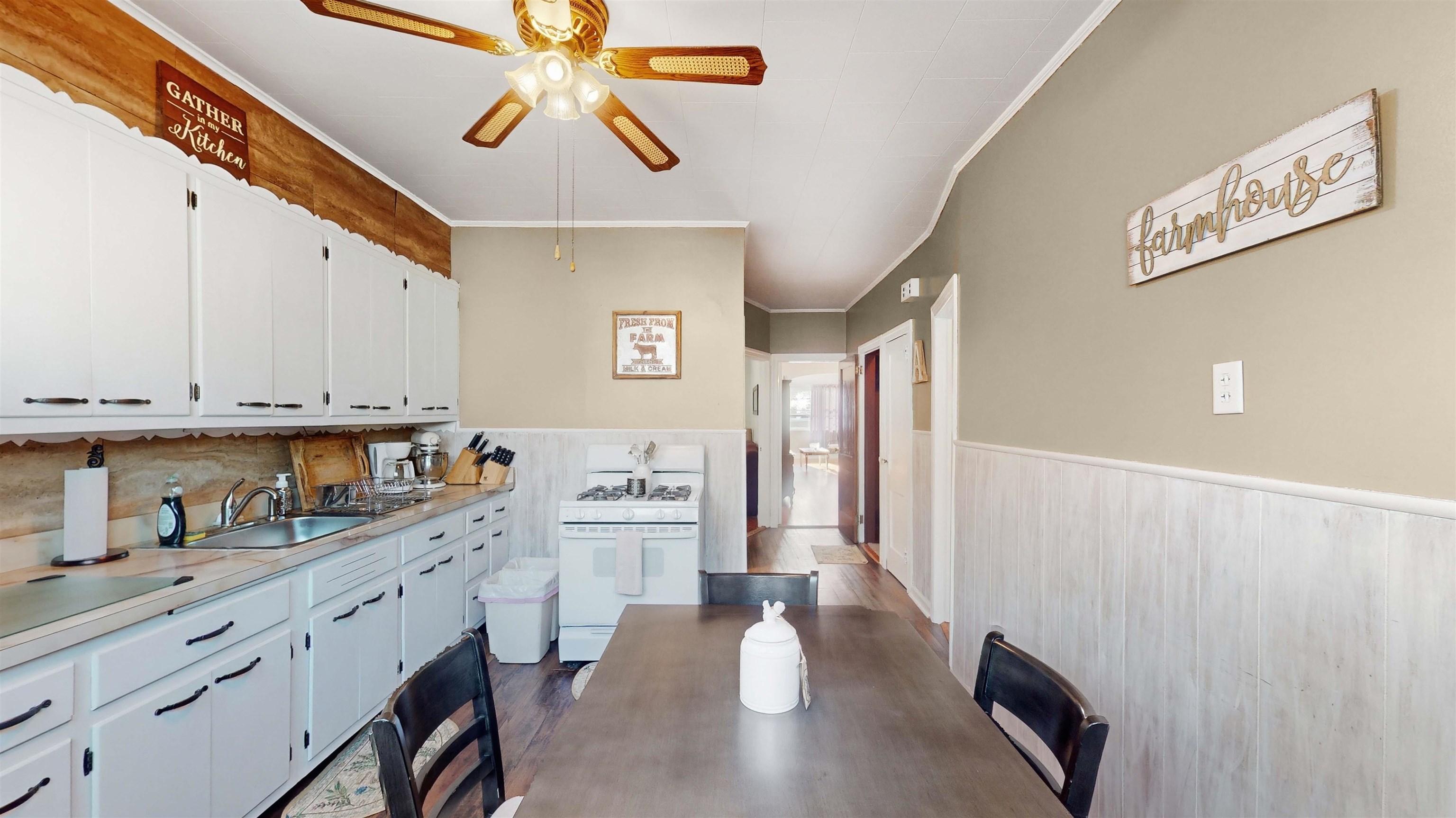159 West 32nd Street Bayonne, NJ 07002 - Photo 21 of 47 a kitchen with stainless steel appliances white cabinets and wooden floor