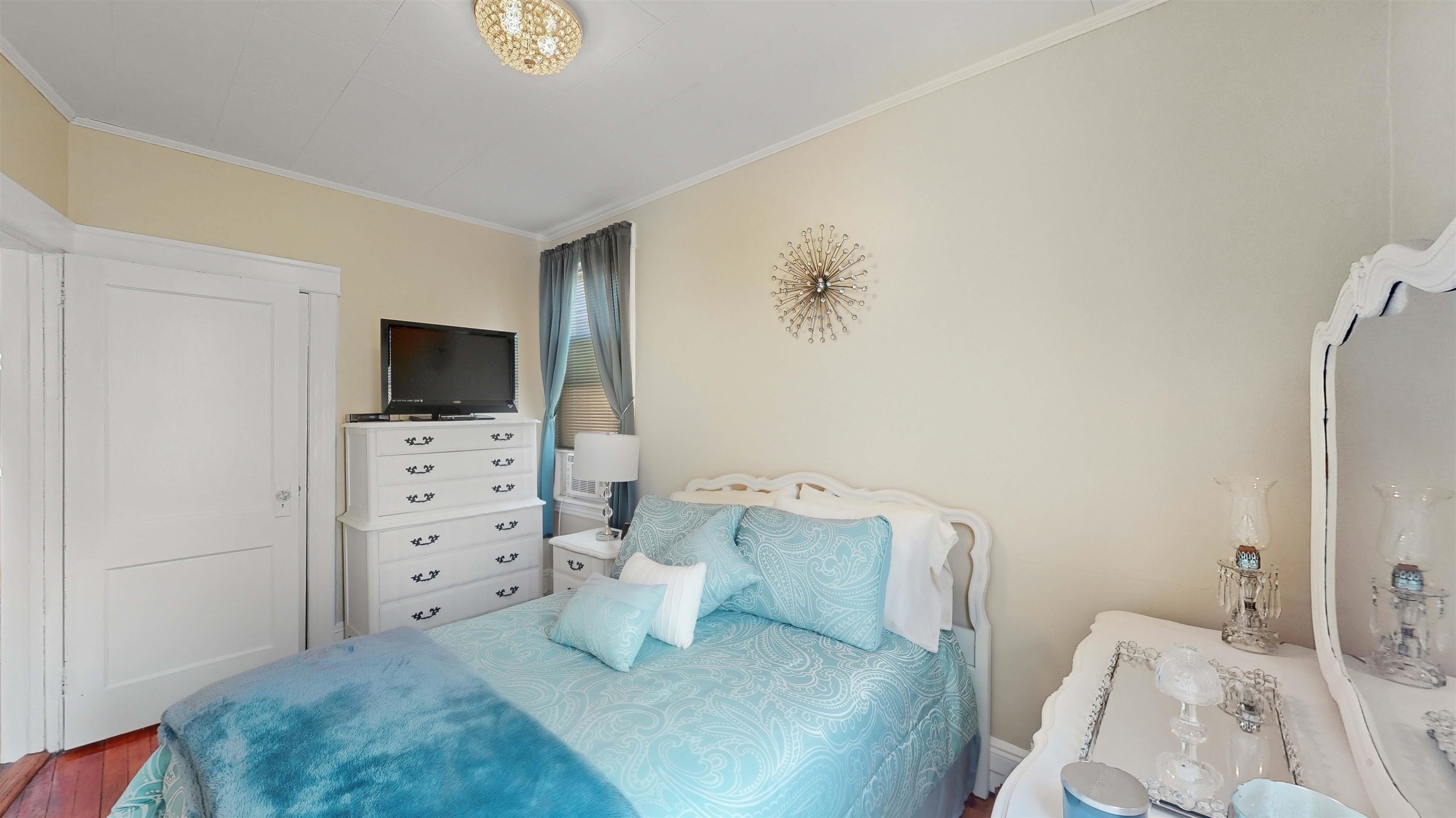 159 West 32nd Street Bayonne, NJ 07002 - Photo 23 of 47 a living room with furniture and a flat screen tv