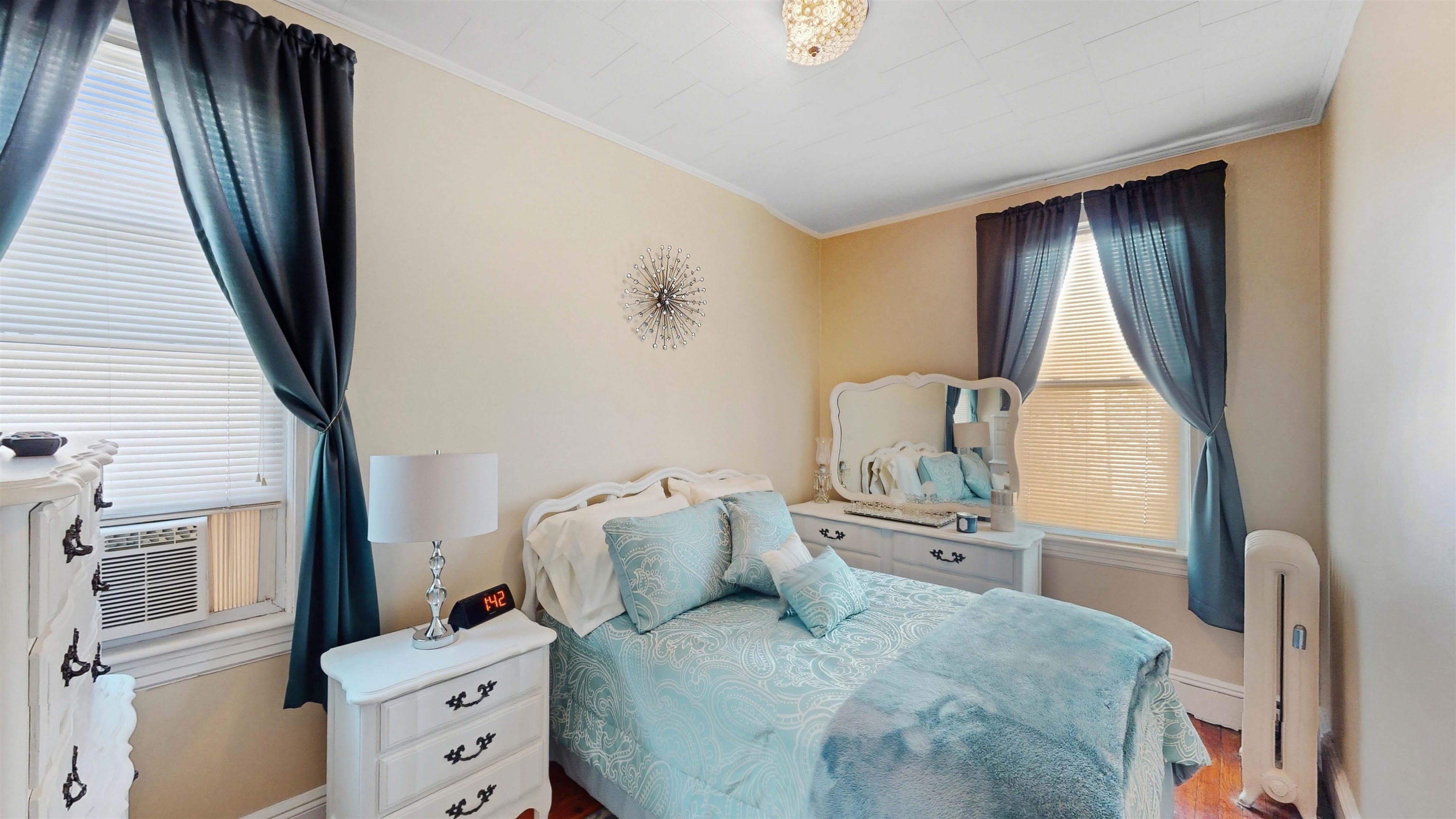 159 West 32nd Street Bayonne, NJ 07002 - Photo 24 of 47 a bedroom with a bed and wooden floor