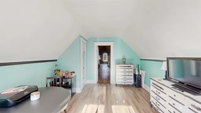 a view of a livingroom with furniture and a window