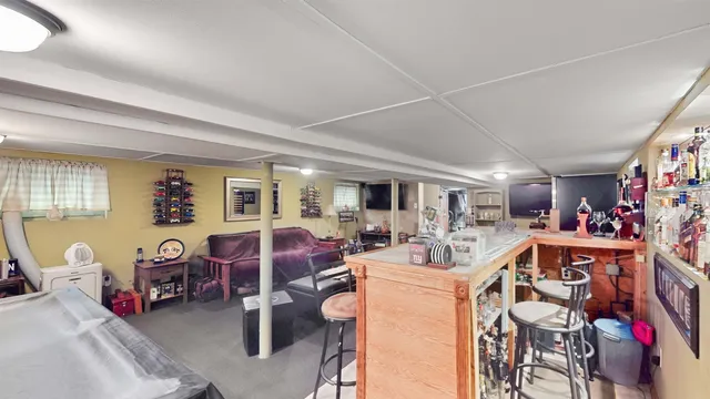 a view of a livingroom with furniture and toys