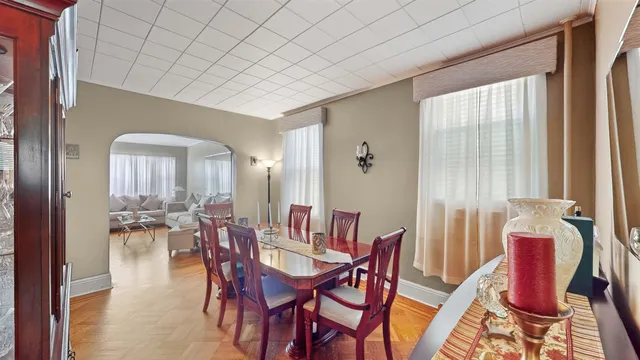 a dining room with furniture and window
