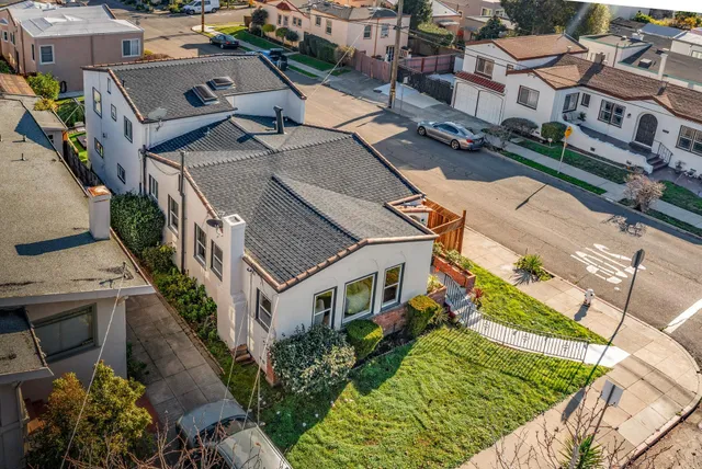 an aerial view of a house with a garden and plants