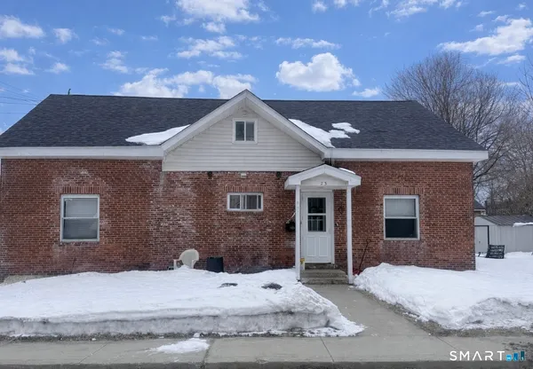 a front view of a house with yard
