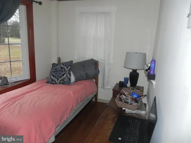 a view of walk in closet with clothes