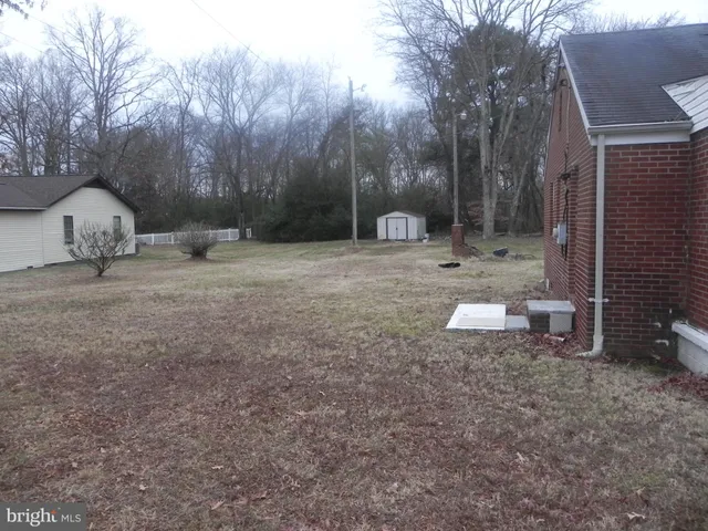 a view of backyard with green space