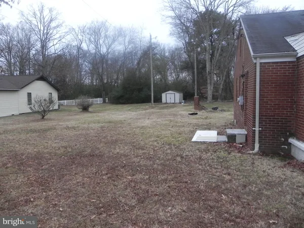 a view of backyard with green space