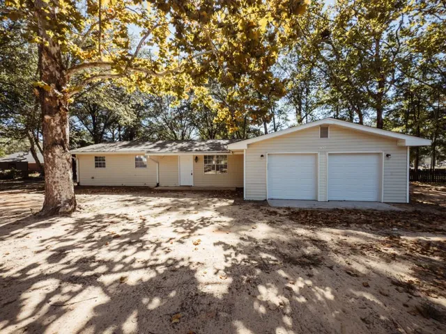 a view of garage and yard