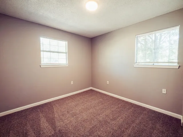 an empty room with windows