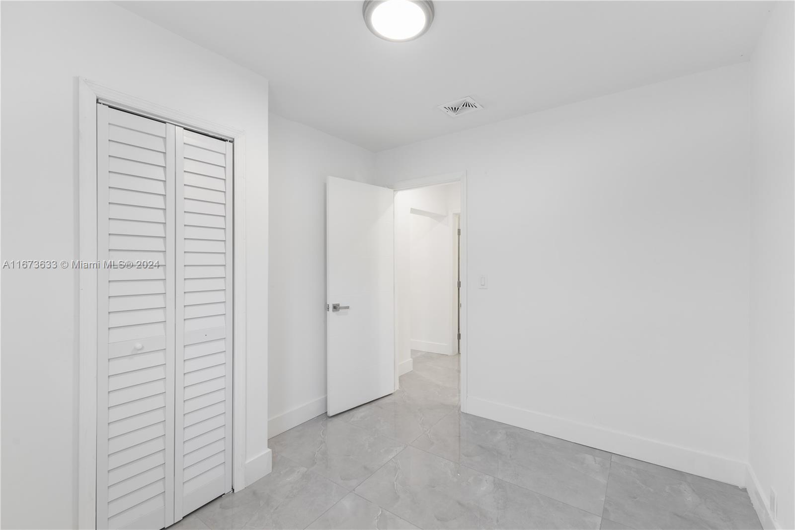 2320 Northwest 55th Street Miami, FL 33142 - Photo 12 of 34 a view of an empty room