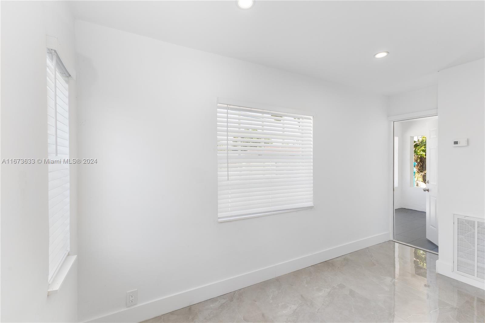 2320 Northwest 55th Street Miami, FL 33142 - Photo 15 of 34 a view of an empty room with a window