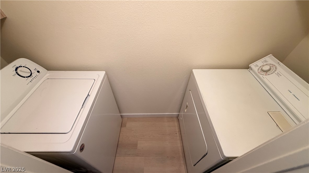 7885 West Flamingo Road, Unit 1131 Las Vegas, NV 89147 - Photo 33 of 36 Functional laundry appliances provide everyday convenience in this dedicated utility space.