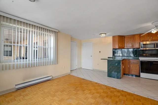 a view of a kitchen with a sink dishwasher and a refrigerator