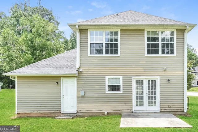 a front view of a house with a yard