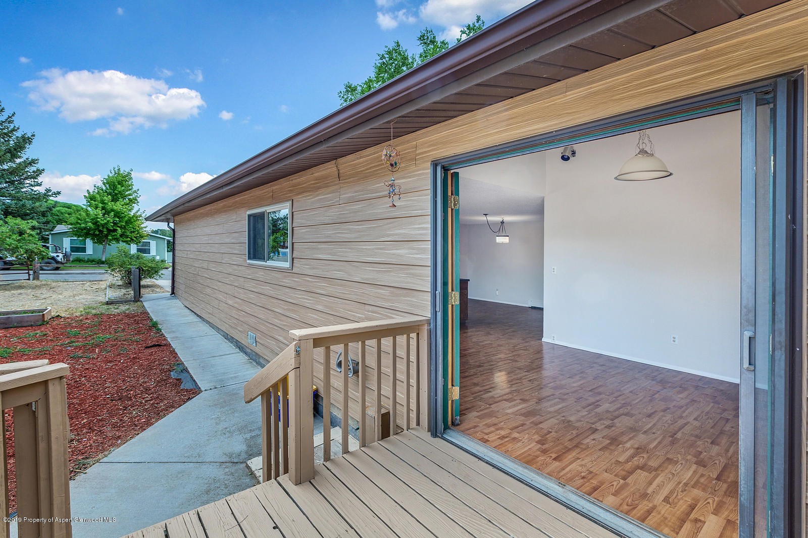 315 Will Avenue Rifle, CO 81650 - Photo 8 of 26 a view of a balcony with wooden floor