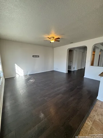 a kitchen with stainless steel appliances granite countertop a refrigerator a stove top oven a sink and dishwasher