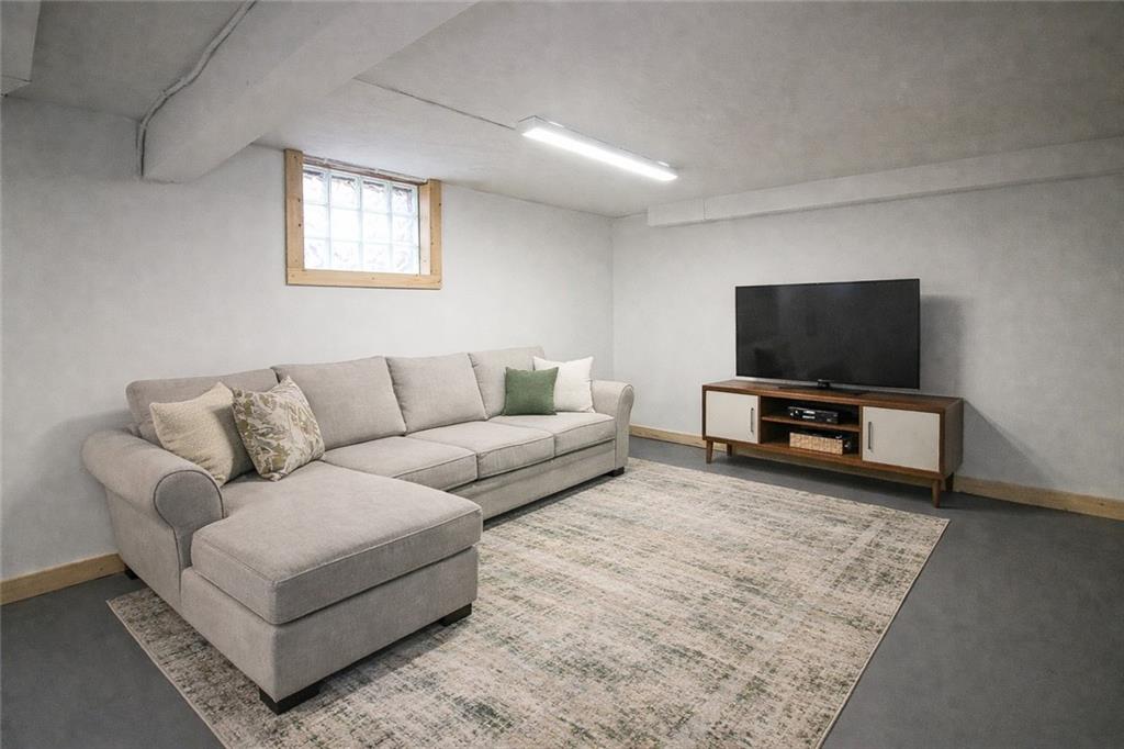 164 Gill Hall Road Clairton, PA 15025 - Photo 23 of 30 a living room with furniture and a flat screen tv