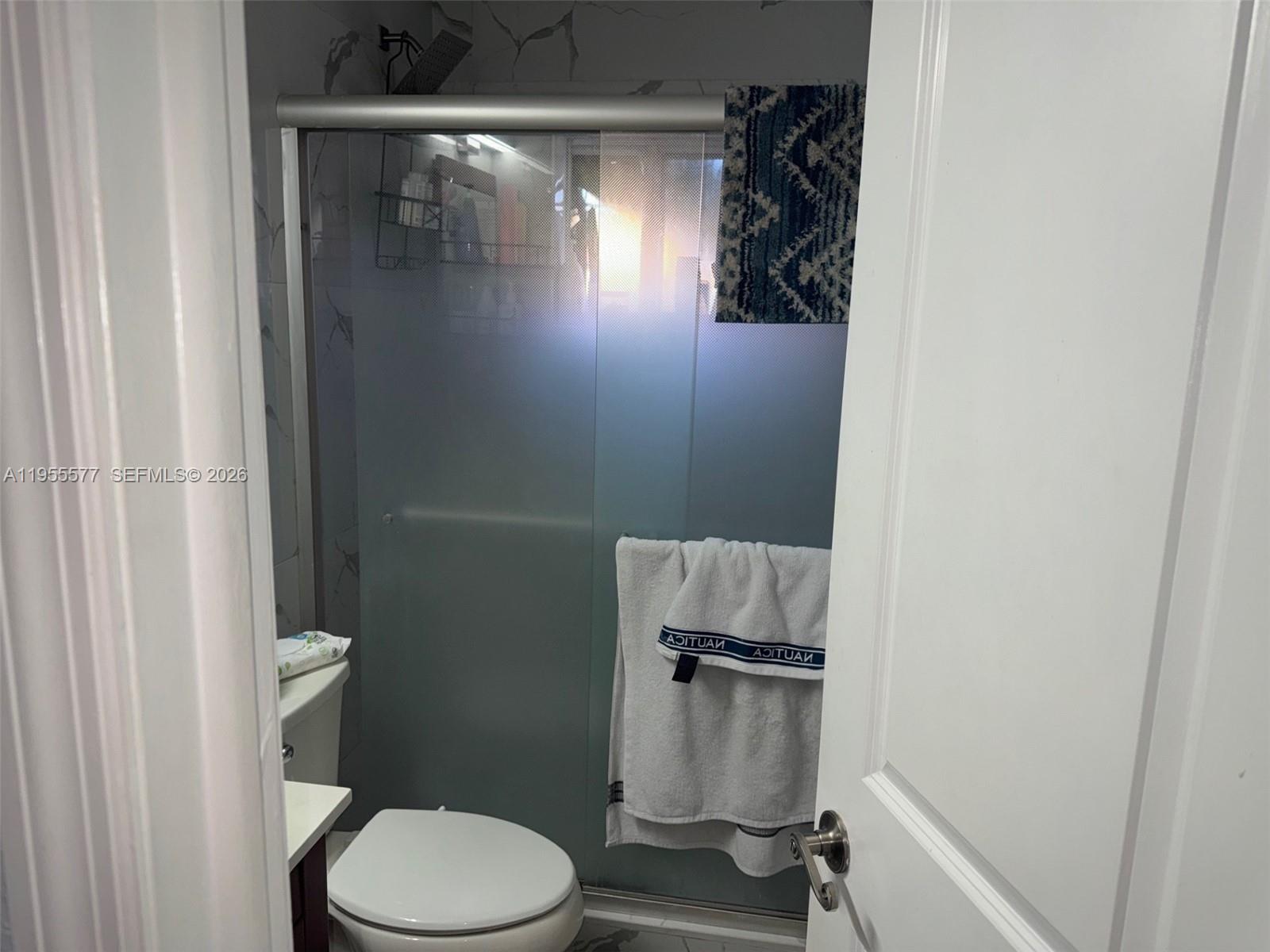 3375 West 76th Street, Unit 223 Hialeah, FL 33018 - Photo 16 of 26 a bathroom with a toilet and a shower