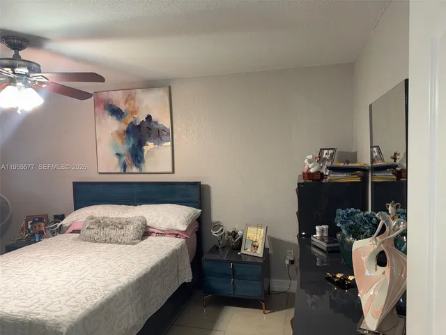 a bedroom with a bed and dresser