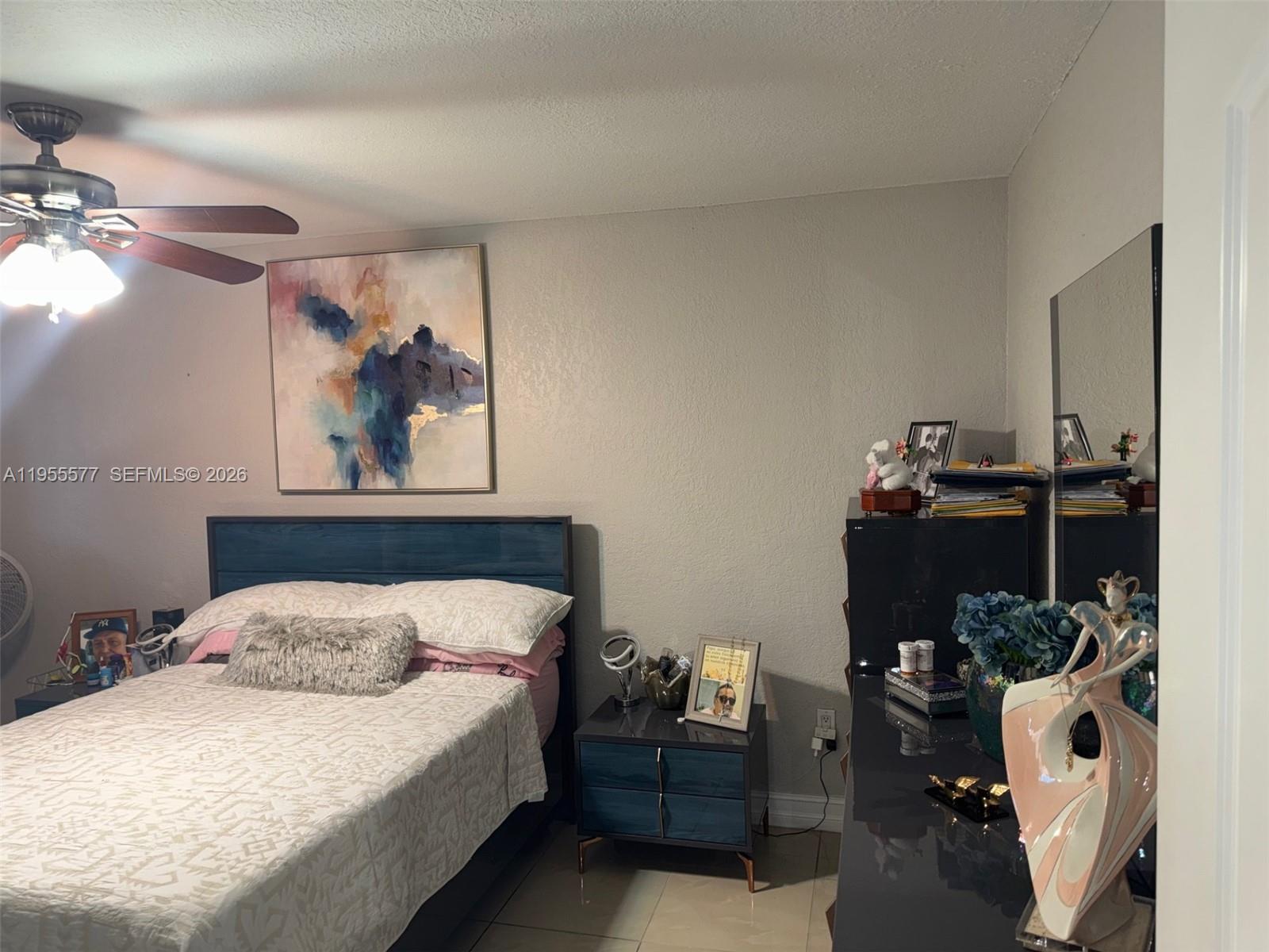 3375 West 76th Street, Unit 223 Hialeah, FL 33018 - Photo 18 of 26 a bedroom with a bed and dresser