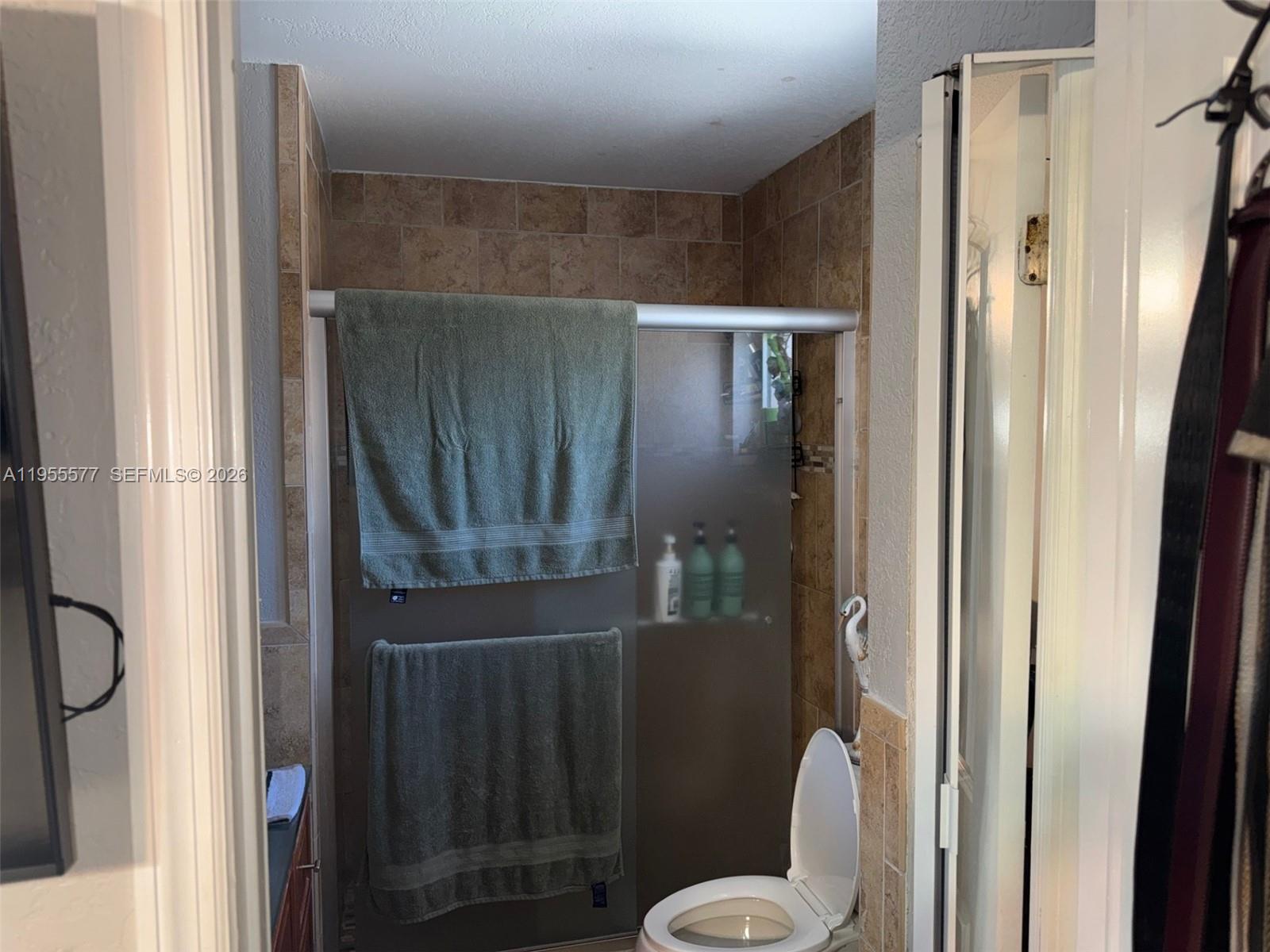 3375 West 76th Street, Unit 223 Hialeah, FL 33018 - Photo 19 of 26 a bathroom with a shower and toilet