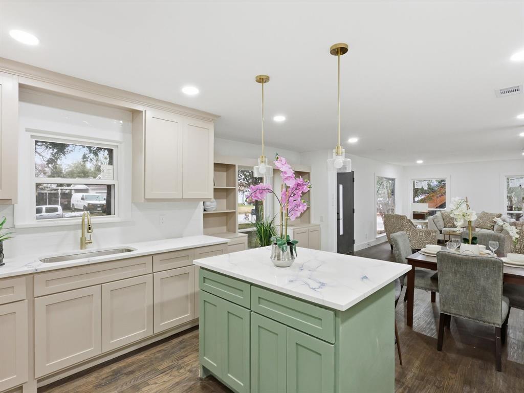 6624 Reeves Street Richland Hills, TX 76118 - Photo 13 of 27 a kitchen with a sink a counter space appliances and cabinets