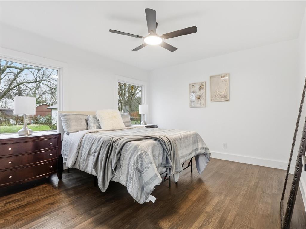 6624 Reeves Street Richland Hills, TX 76118 - Photo 23 of 27 a spacious bedroom with a bed and a window