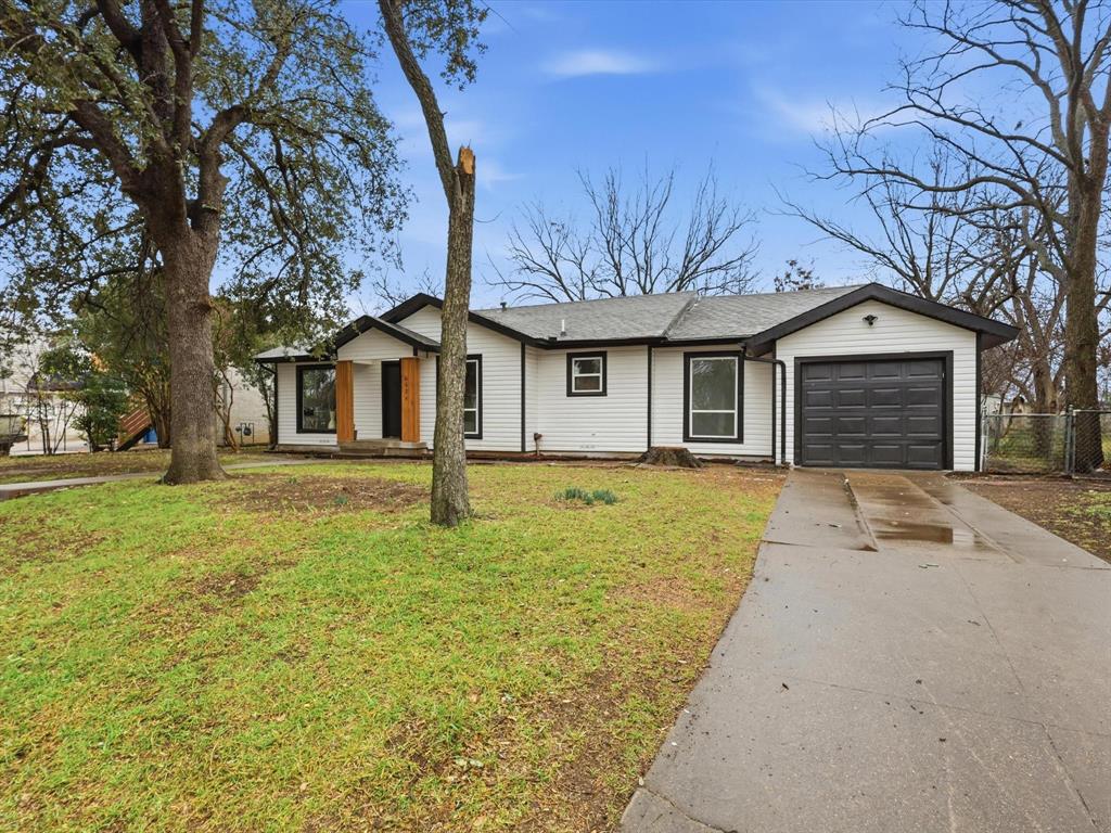6624 Reeves Street Richland Hills, TX 76118 - Photo 25 of 27 a front view of a house with a garden