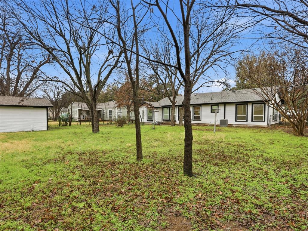 6624 Reeves Street Richland Hills, TX 76118 - Photo 27 of 27 a backyard of a house with lots of green space