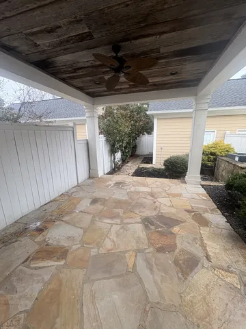 a spacious bedroom with a large bed and a potted plant