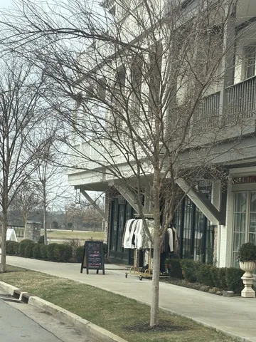 a building outdoor space with lots of trees and plants