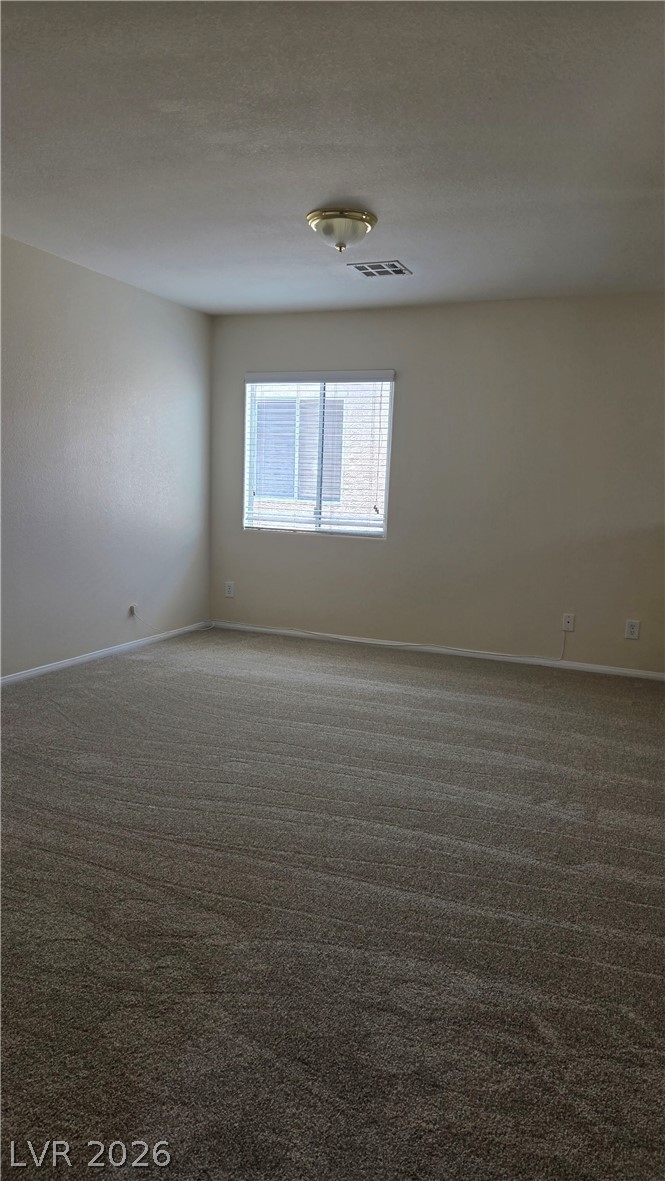 9031 Spring Star Court Las Vegas, NV 89148 - Photo 10 of 17 An inviting atmosphere fills this room, complete with freshly installed carpet.