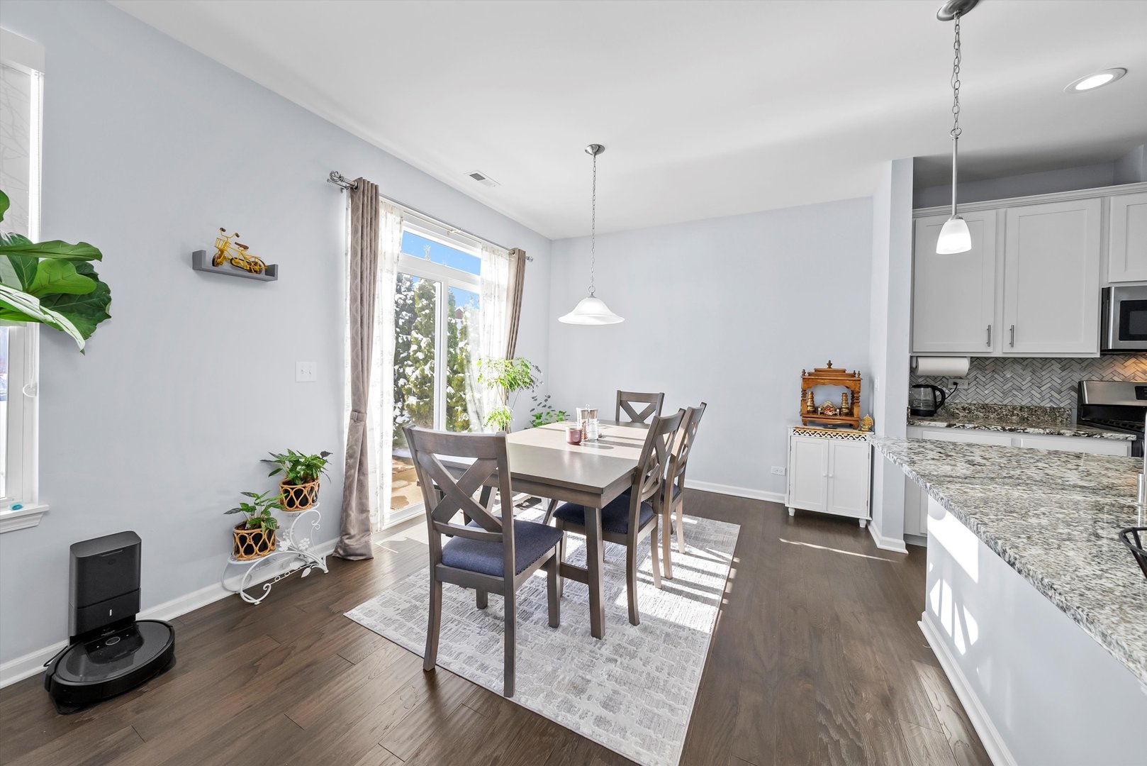 4177 Irving Road Aurora, IL 60504 - Photo 11 of 39 a view of a dining room with furniture window and wooden floor
