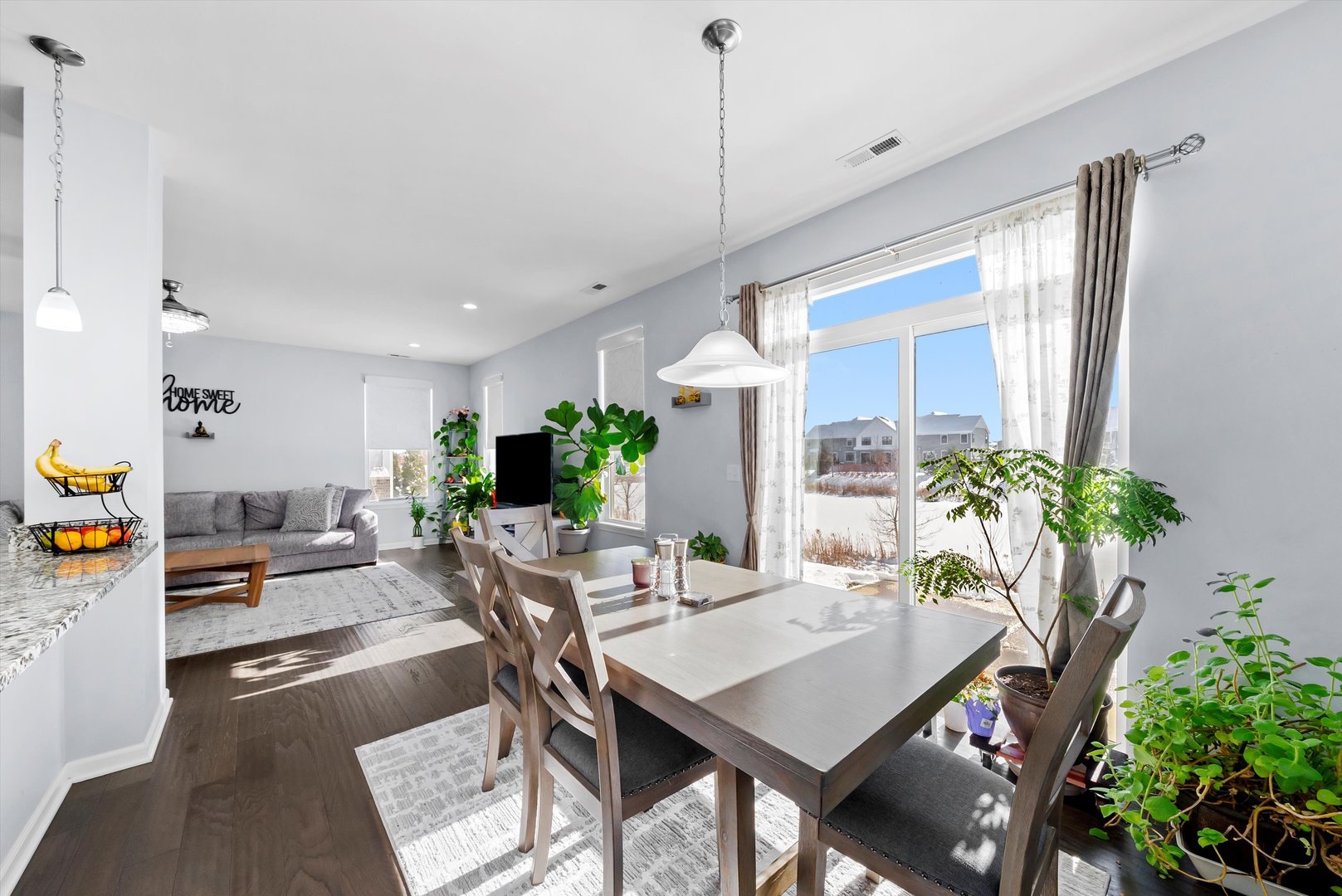 4177 Irving Road Aurora, IL 60504 - Photo 12 of 39 a view of a dining room with furniture window and wooden floor