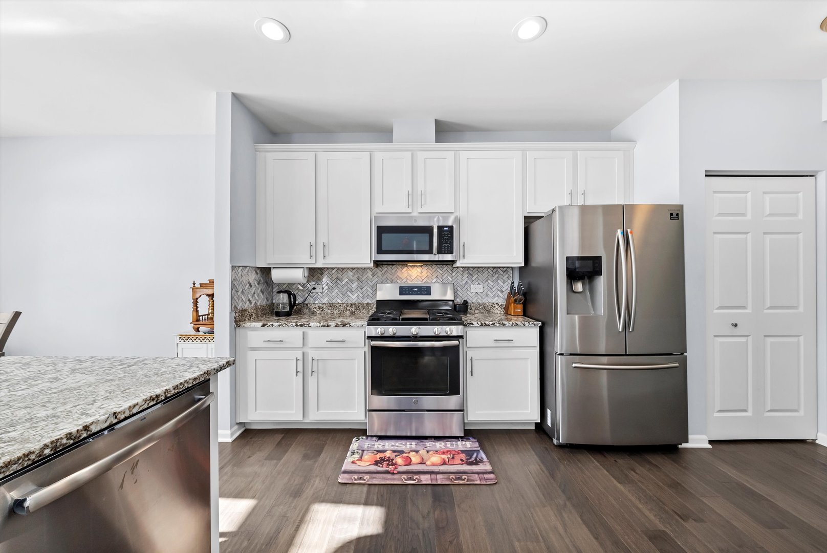 4177 Irving Road Aurora, IL 60504 - Photo 17 of 39 a kitchen with a refrigerator and a stove top oven