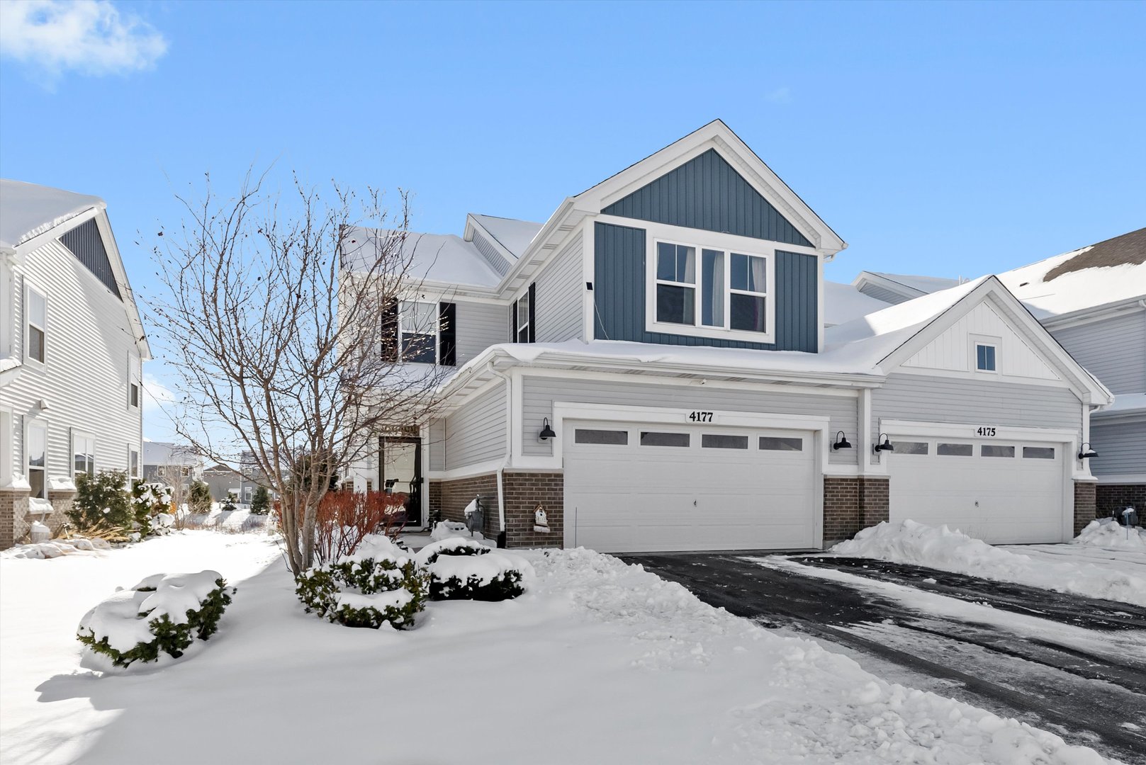 4177 Irving Road Aurora, IL 60504 - Photo 2 of 39 a view of a white house with a snow in front of it