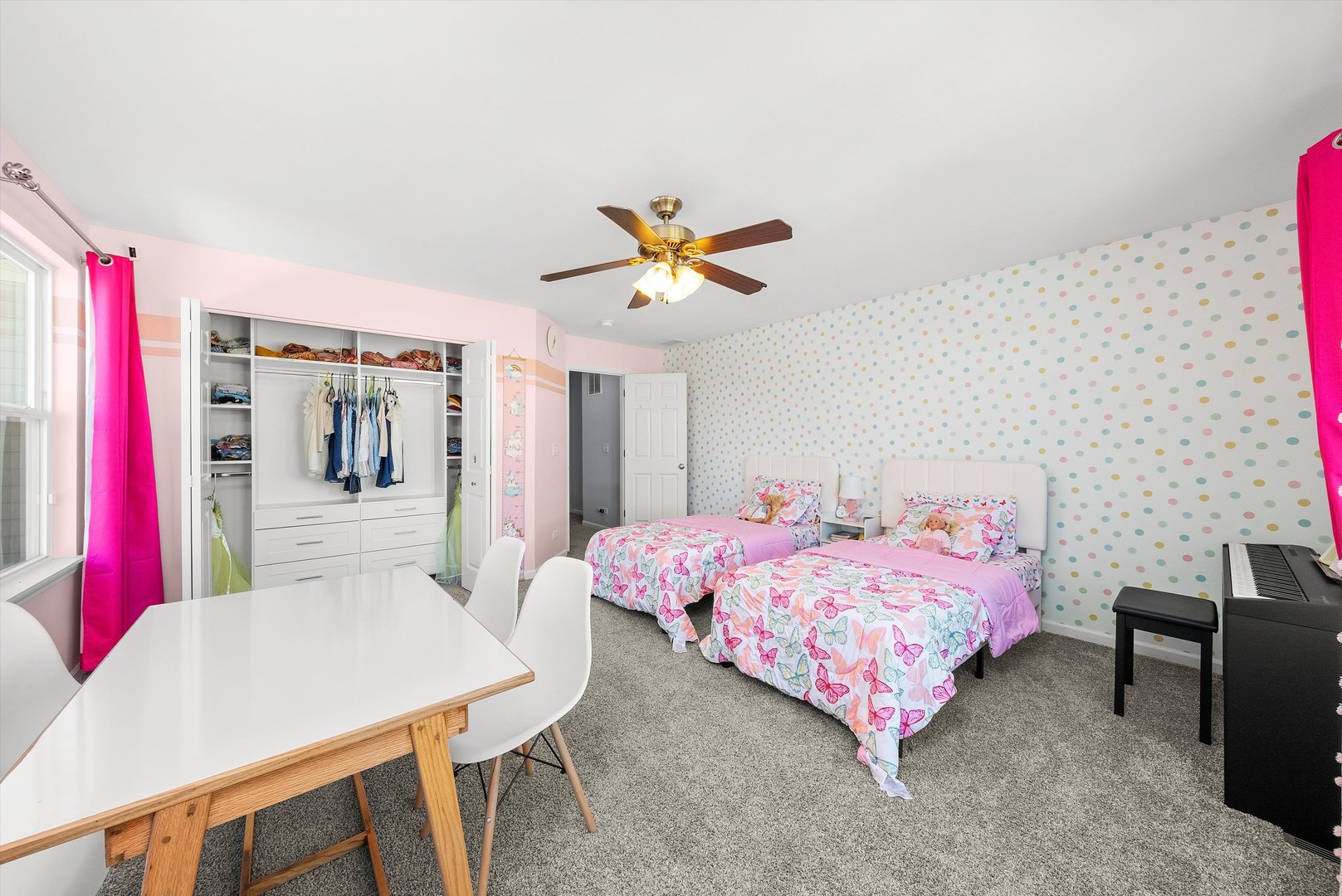 4177 Irving Road Aurora, IL 60504 - Photo 23 of 39 a bedroom with a bed and a chandelier