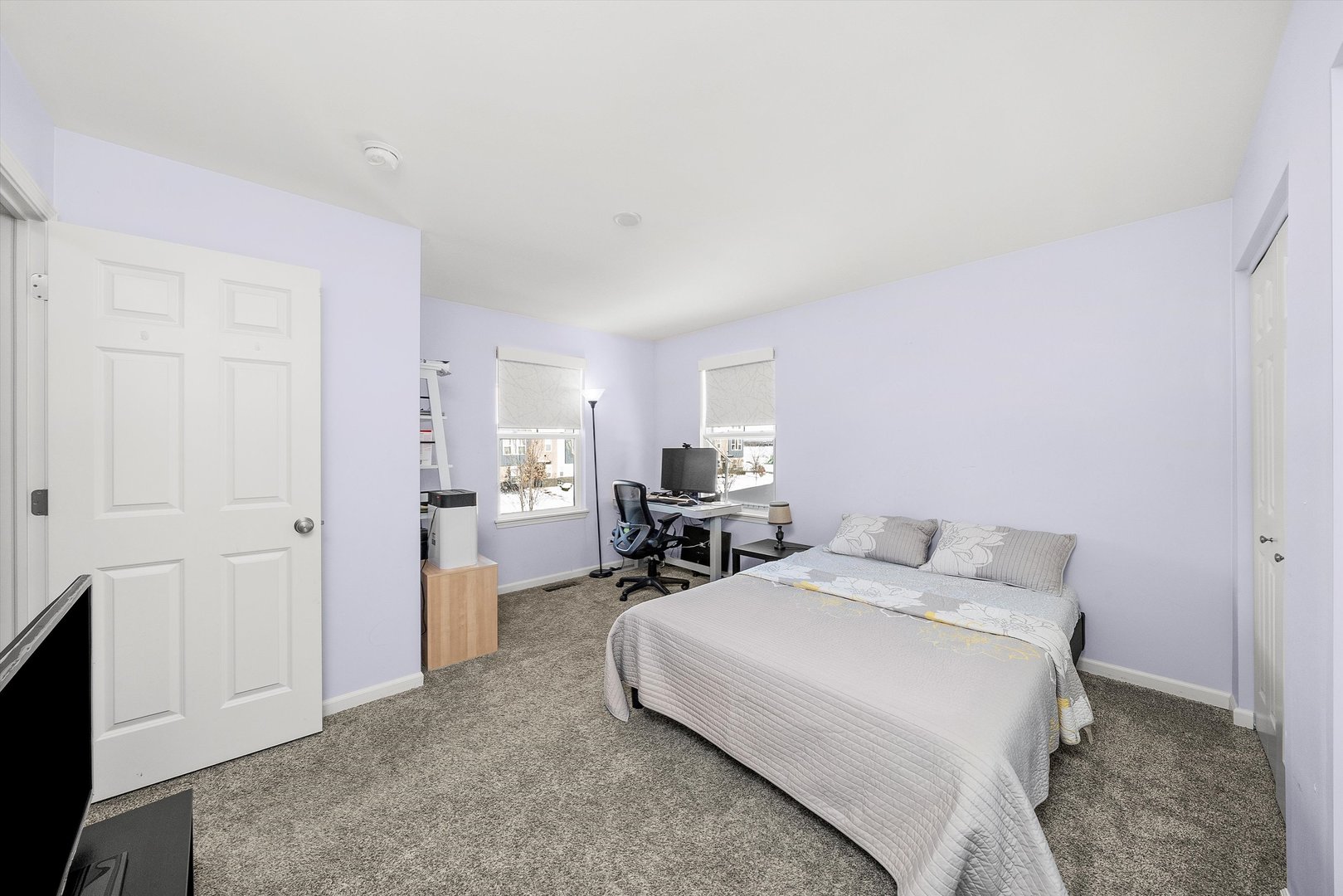 4177 Irving Road Aurora, IL 60504 - Photo 25 of 39 a bedroom with a bed and a view of kitchen