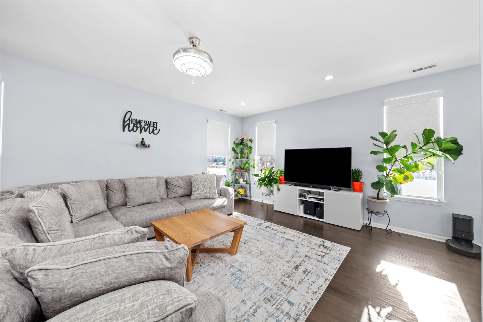 4177 Irving Road Aurora, IL 60504 - Photo 8 of 39 a living room with furniture and a flat screen tv