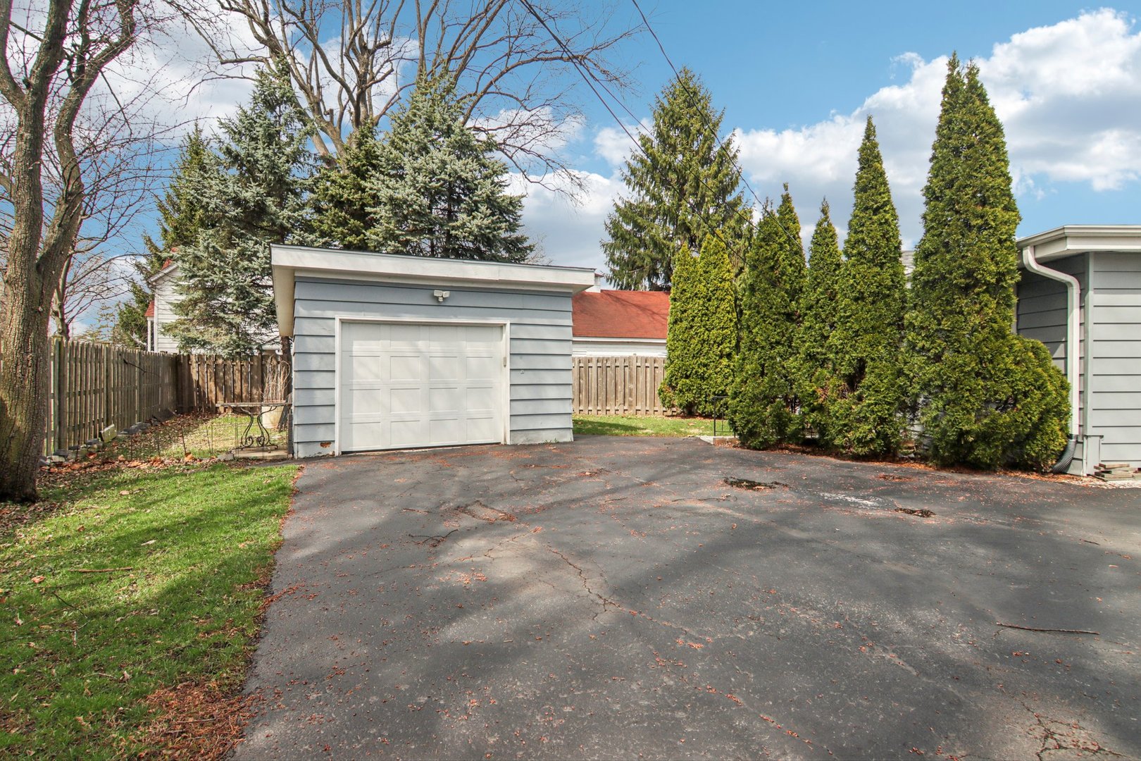 238 West Frontage Road Northfield, IL 60093 - Photo 13 of 16 a view of a house with a yard and garage
